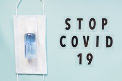 medical mask and sanitizer on blue background Product Image 1