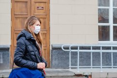 woman wears medical mask in the empty street. Product Image 1