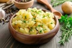 Homemade creamy mashed potatoes in wooden bowl Product Image 1
