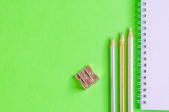 School and office supplies on office table, green background Product Image 1