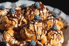 Closeup of homemade profiteroles with custard cream Product Image 1