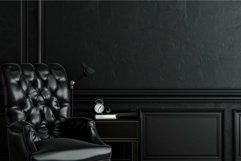 Luxurious black leather armchair standing in a dark chic hom Product Image 1