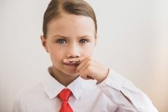 Beautiful child girl shows painted mustache Product Image 1