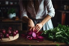 Woman slicing red onions on wooden table Product Image 1