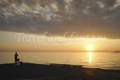 Lonely man fishing on the pier at sunset and calm . Product Image 1