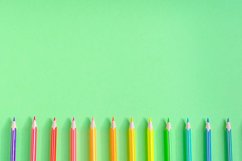 School and office supplies on office table, green background Product Image 1