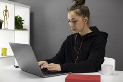 Beautiful hipster girl freelancer working at laptop Product Image 1