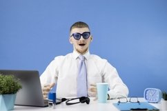 Handsome man dressed in classic shirt with blue tie Product Image 1