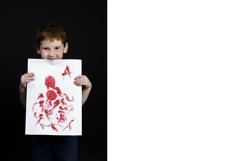 a beautiful six-year-old boy holds a large sheet Product Image 1