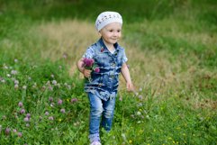 Cute baby girl on a walk in the Park Product Image 1