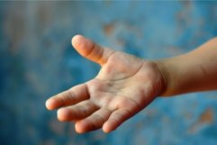 Child holding out empty hand asking for help Product Image 1