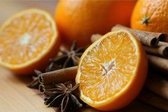 Freshly cut orange and cinnamon sticks creating warm winter Product Image 1