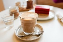 Coffee and Cake on wooden table in the cafe Product Image 1