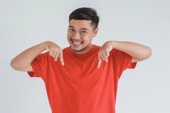 Smiling Asian man with pointing down Product Image 1