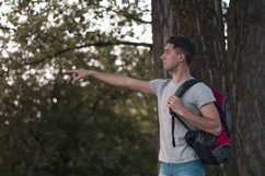 Young caucasian man walks in a park Product Image 1