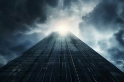 Skyscraper upward view against dramatic sky Product Image 1