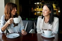 Girls Drinking Coffee in Cafe. business meeting Product Image 1