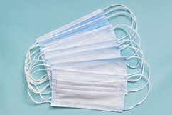 medical masks on blue background with copy space Product Image 1