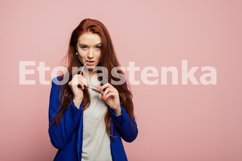 A redhead girl is on the pink background. Product Image 1