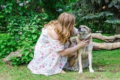 Portrait of beautiful young woman with her dog. Product Image 1