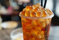 Plastic glass full of iced tea with bubbles and topped with Product Image 1