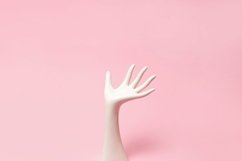 White ceramic statue hand on pink background with copy space Product Image 1