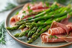 Fresh asparagus wrapped in prosciutto on a plate Product Image 1