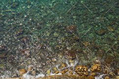 Aerial view of sea with stones near coast Product Image 1