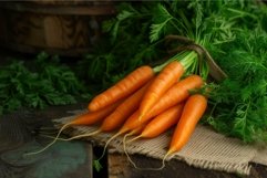 Fresh harvested carrots on rustic wooden background Product Image 1