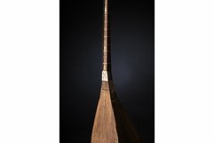 Part ancient Asian stringed musical instrument on black Product Image 1