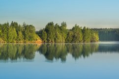 Reflection of green trees in the lake. Nature. Morning Product Image 1