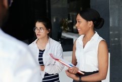 Jpg photography - Two multinational women talking in office Product Image 1