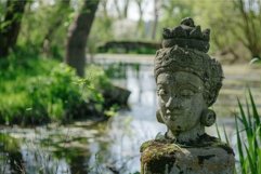 Serene garden statue by pond Product Image 1