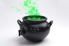 Black Pot with Green Liquid Background Wallpaper Product Image 1