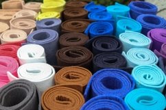 Rolled fabric samples found on a market - background Product Image 1