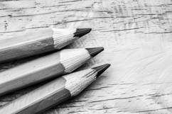 Pencils with Wooden Board Background Wallpaper Product Image 1
