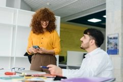 Female boss communicates with an employee in the office Product Image 1