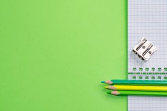 School and office supplies on office table, green background Product Image 1