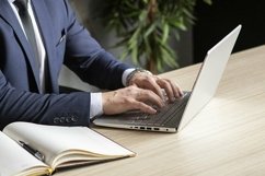 portrait of a businessman in a dark blue suit in the office Product Image 1