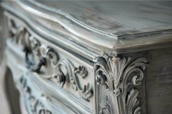 Closeup of a weathered vintage dresser with ornate woodwork Product Image 1