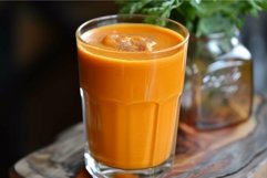 Fresh carrot juice in a clear glass Product Image 1