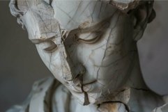 Damaged statue of a man conveys sadness and the passage of t Product Image 1