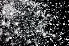 Freeze motion of white powder coming down, isolated on black Product Image 1