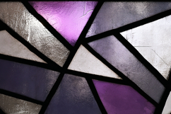 A close-up view of a stained glass window with purple Product Image 1