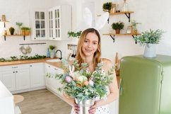 Beautiful woman wearing bunny ears poses in the kitchen Product Image 1