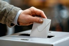 Hand casting vote in ballot box Product Image 1