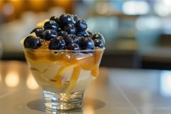 Delicious caramel pudding dessert topped with fresh blueberr Product Image 1