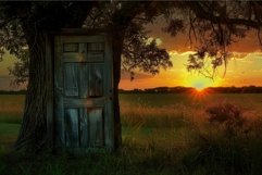 Rustic abandoned outhouse at sunset Product Image 1