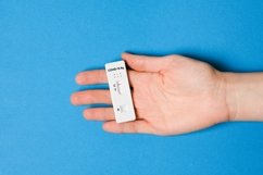 Hand holding negative test result by using rapid test Product Image 1