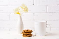 White coffee mug mockup with soft yellow orchid in vase Product Image 3